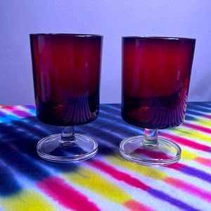Set of two Ruby red glass Luminarc Arcoroc goblets with clear pedestal.